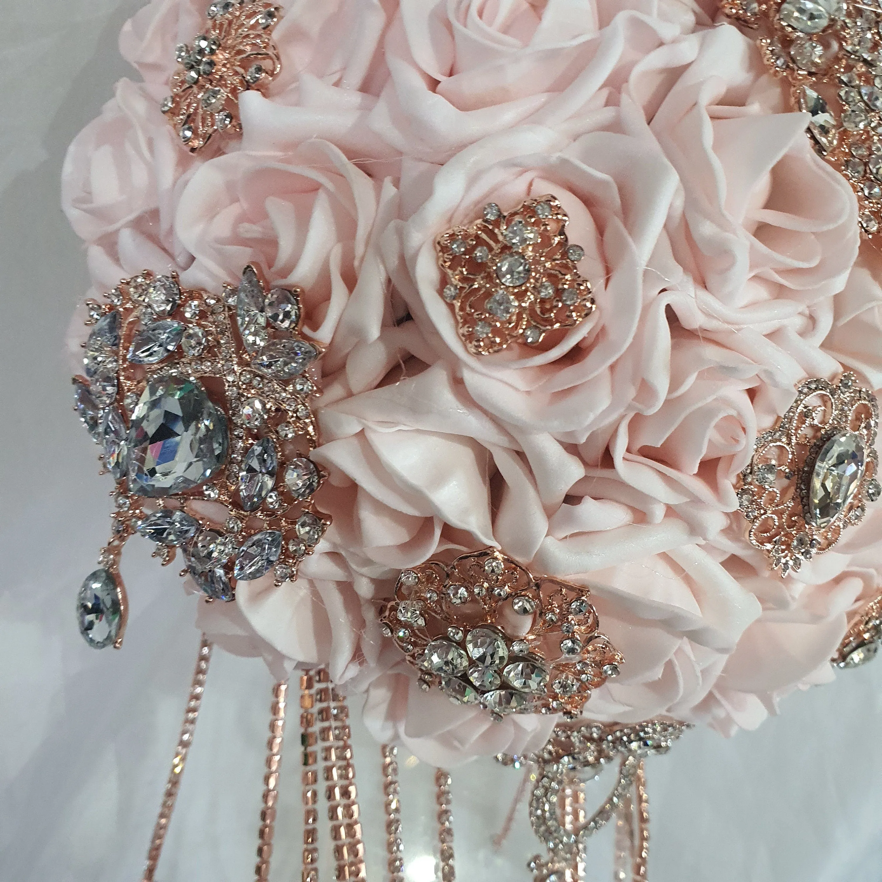 Crystal Brooch blush and rose gold drape  bouquet by Crystal wedding uk