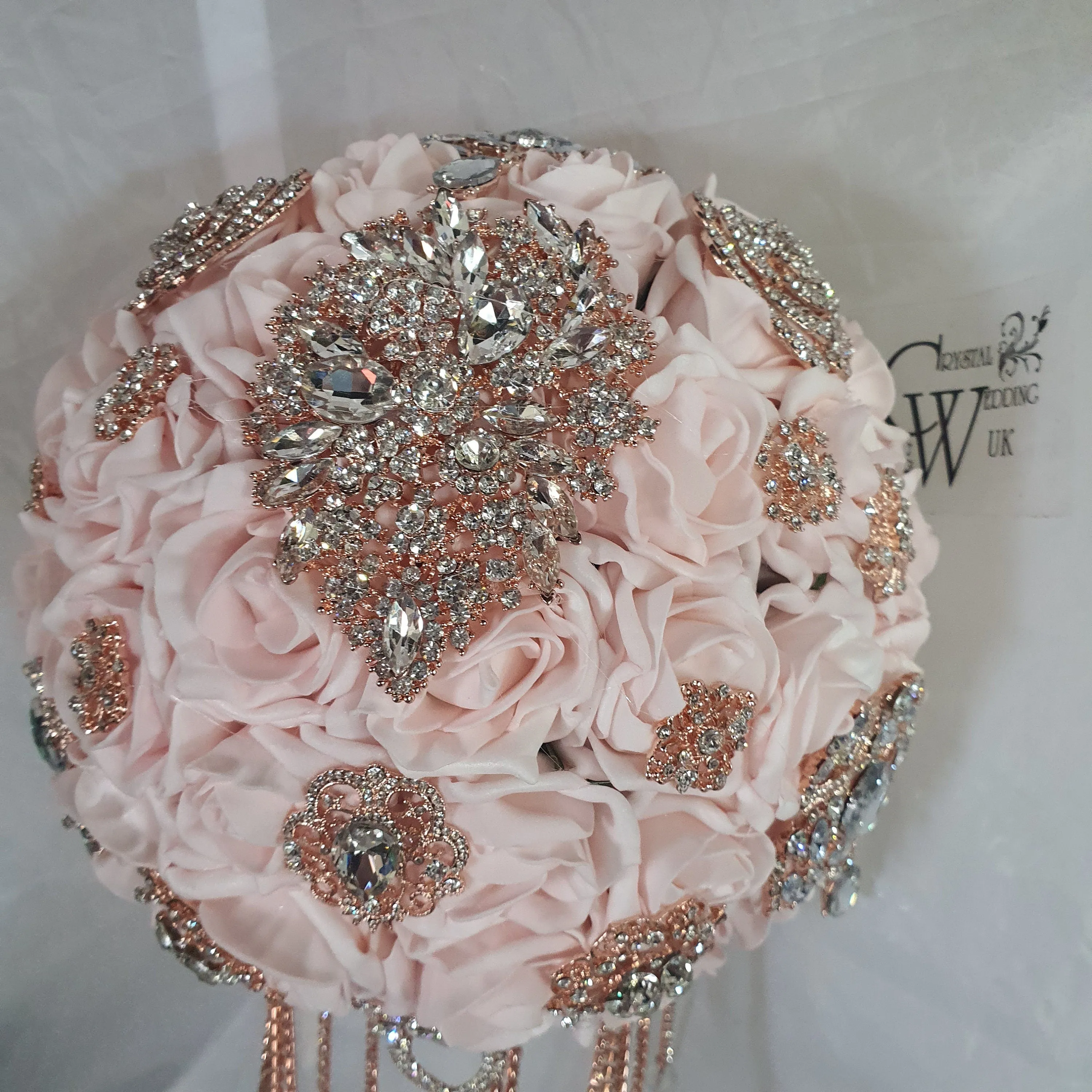 Crystal Brooch blush and rose gold drape  bouquet by Crystal wedding uk